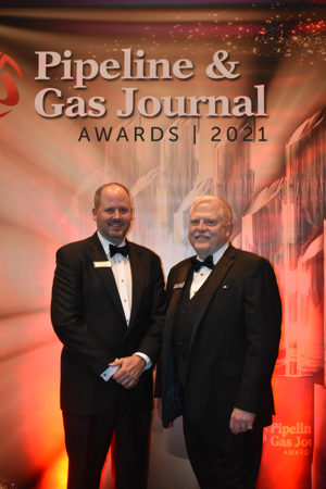 Pipeline &amp; Gas Journal Publisher Andy McDowell, left, poses with Master of Ceremonies Russel Treat at the inaugural Pipeline &amp; Gas Journal Awards in Houston on Thursday evening.